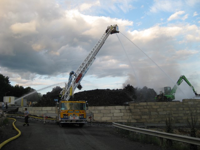 The truck operating at a scrap yard fire in Plainfield Twp.